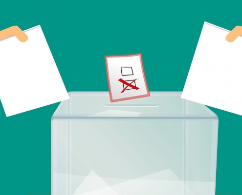 Skizze: Wahlzettel über Wahlurne